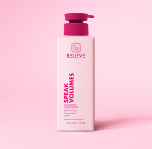 Conditioner bottle with pink pump on a pink background